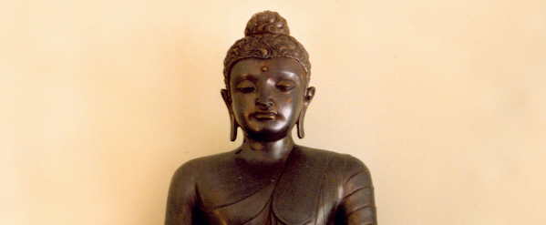 Top of Buddha with pink flowers